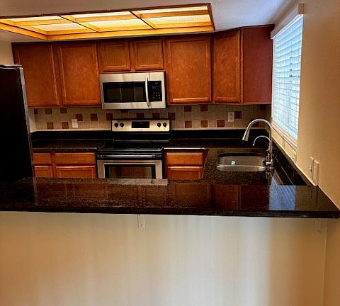 from dining area over the counter to the kitchen