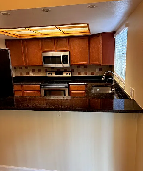 from dining area over the counter to the kitchen