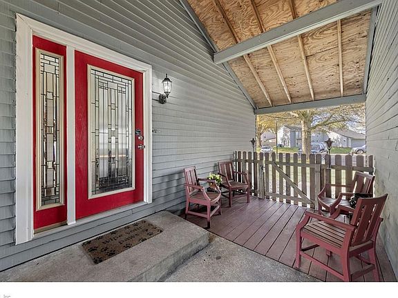 Covered foyer leads to the front door and makes a perfect gathering place for outdoor entertaining and dining.