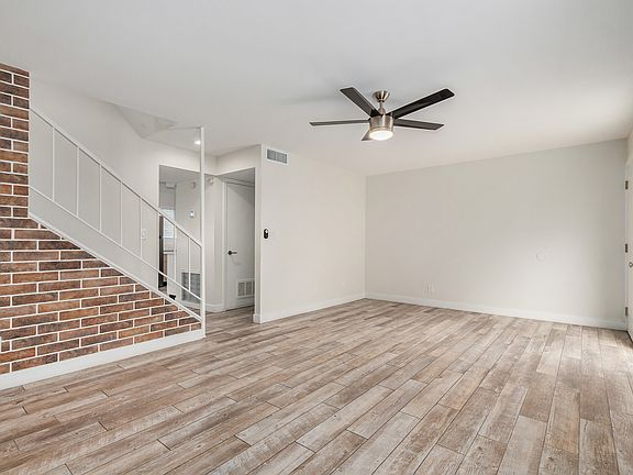 Great room - brick accent wall