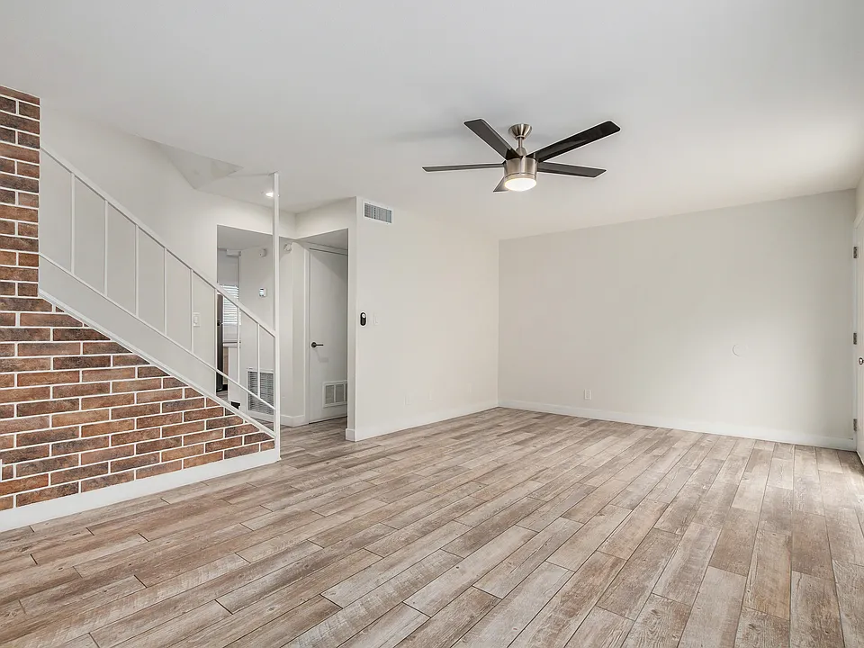 Great room - brick accent wall