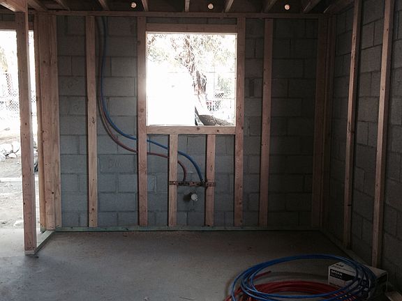 Future kitchen area. Window looks out to shaded backyard.