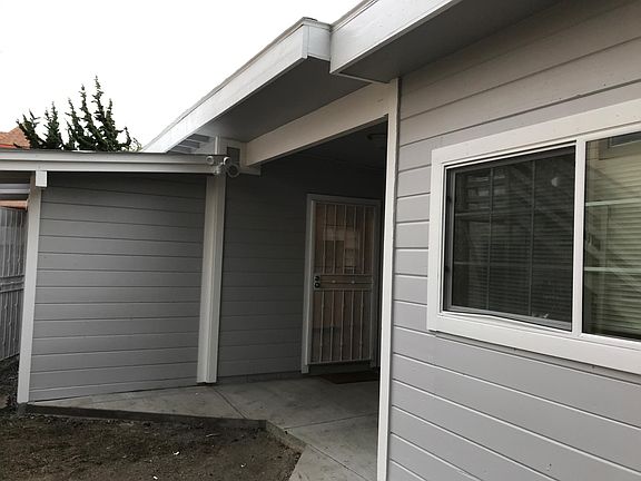 Front entrance Shared laundry room on left. Security lights/camera incl uded