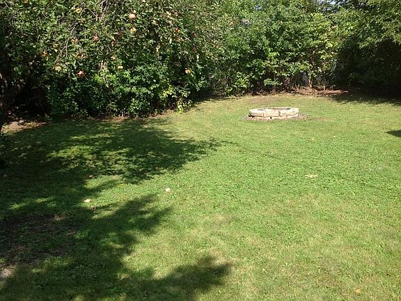 Large backyard with firepit