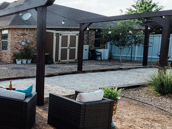 Backyard with the only Bocce Court in Clovis! Shed contains water softener.