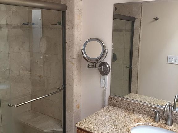 Modern master bath with skylight and heated tile floors