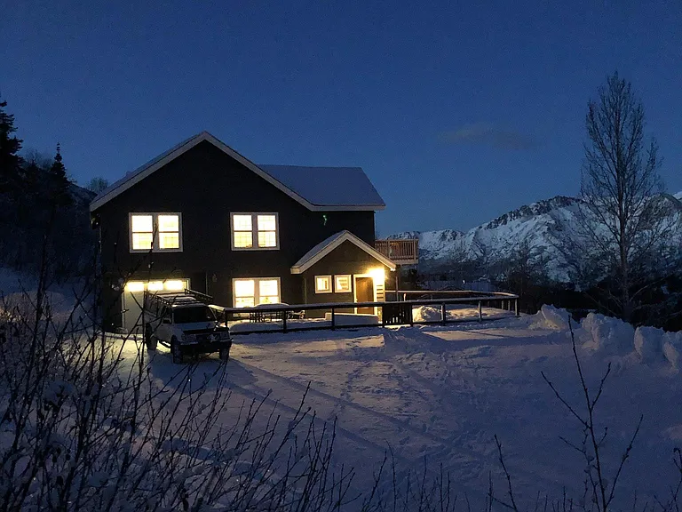 House faces south towards end of valley, Eagle River valley seen in background