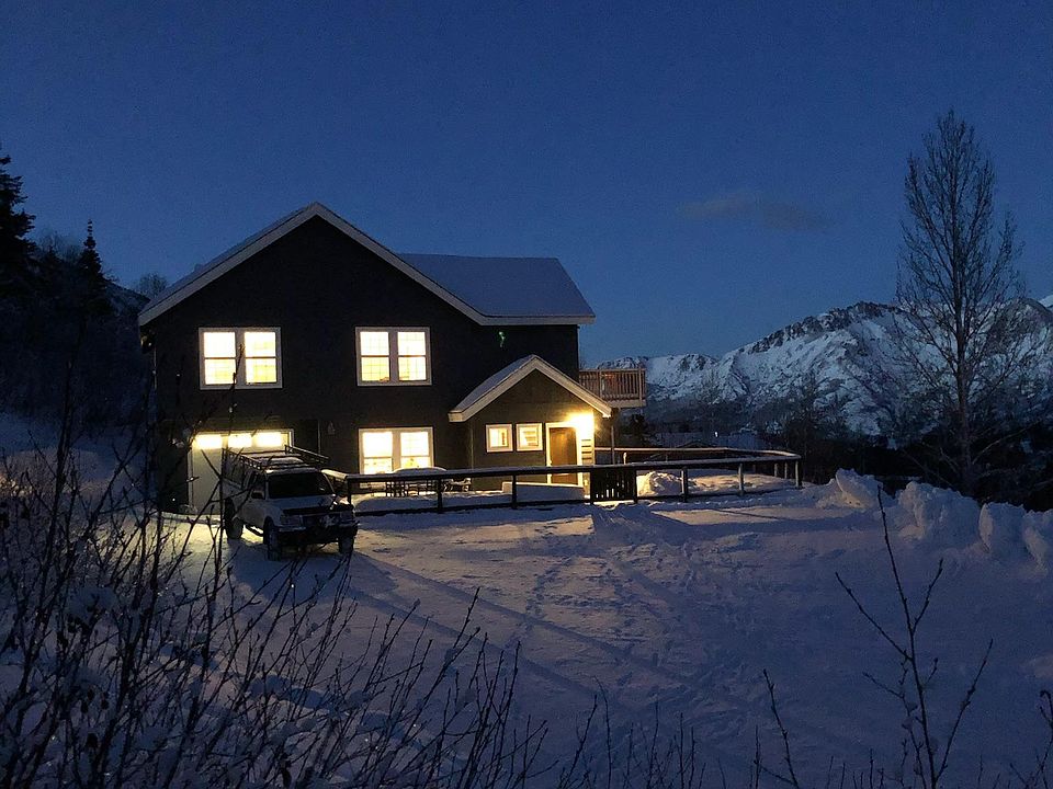 House faces south towards end of valley, Eagle River valley seen in background