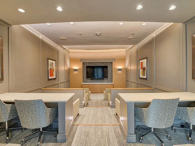 Private screening room featuring surround-sound and stadium seating