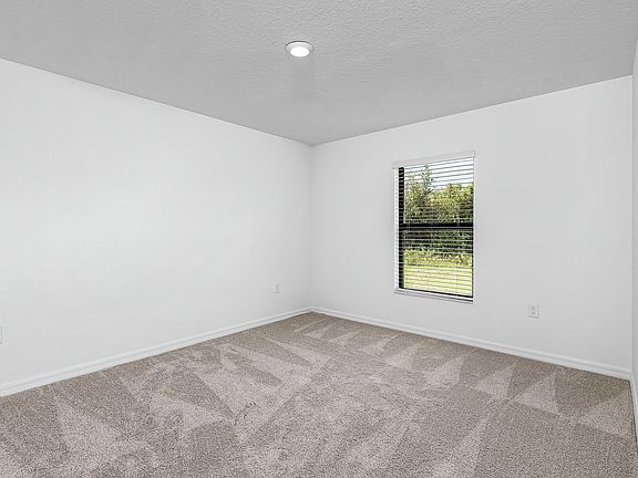 The secluded master bedroom is the perfect place to relax after a long day