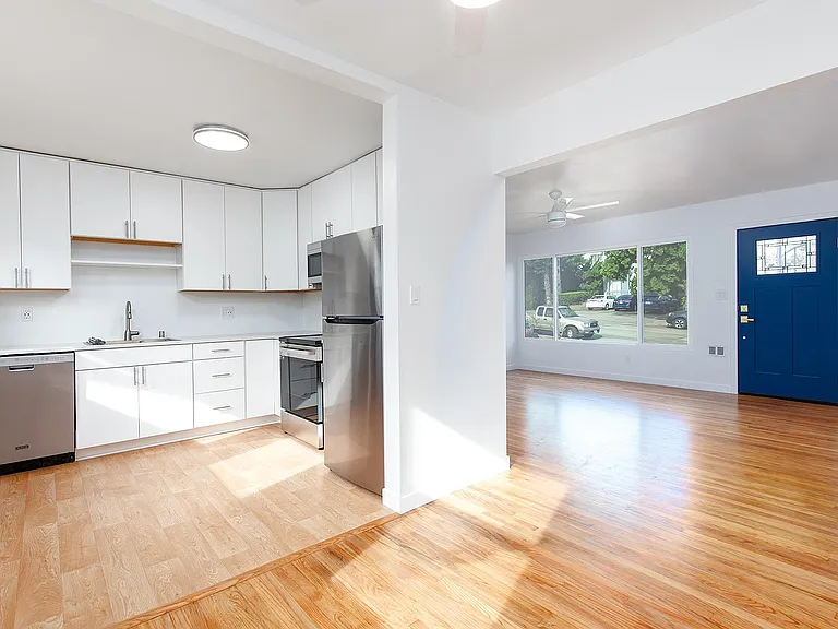 This view is from the dining room into the kitchen and living room.