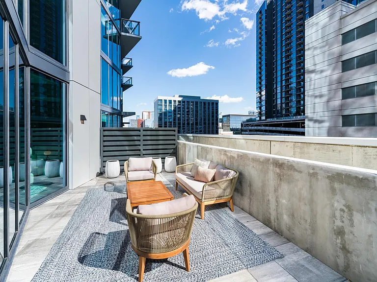 A private outdoor terrace in select homes at Modera McGavock, offering skyline views and relaxed seating just moments from Nashville's vibrant downtown scene.