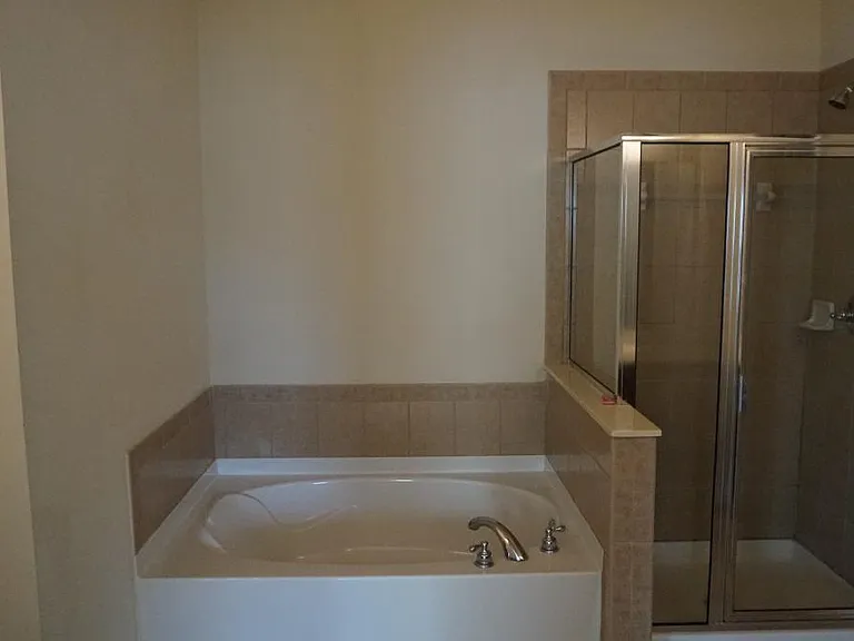 Garden tub and glass shower