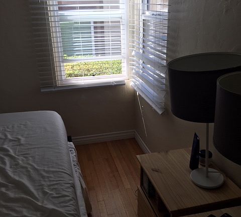 Master Bedroom with refinished hardwood floor and dual-pane vinyl windows