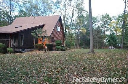 showing cleared back/side yard