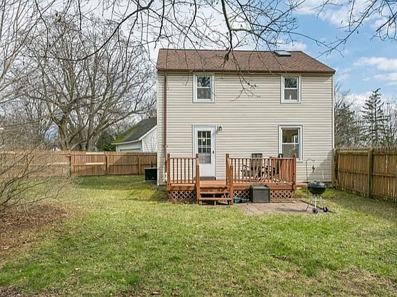 side of house with patio/fenced in backyard