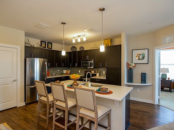 Modern kitchens with solid wood cabinetry, granite counters and stainless appliances