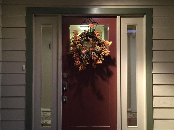 Front door with movement sensor lighting.