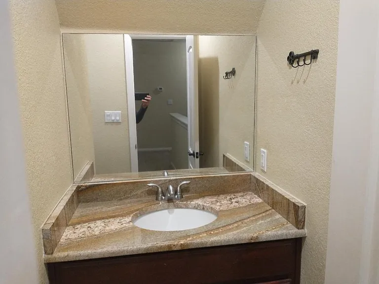 Granite countertops in the bathroom with tub.