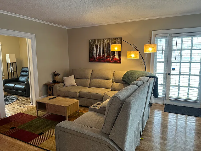 2nd furnished living room with 50 inch smart tv and Alexa enabled lighting and speakers, All wooden floors newly refinished!