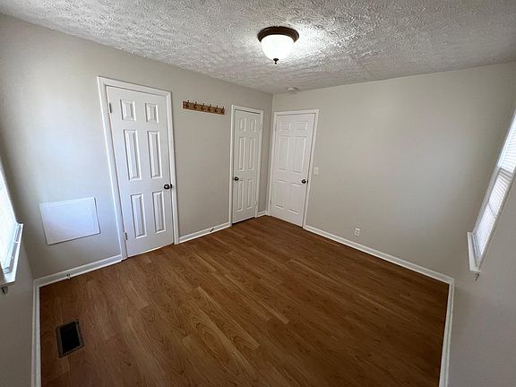 Front Bedroom off of living room, and entry to shared bath