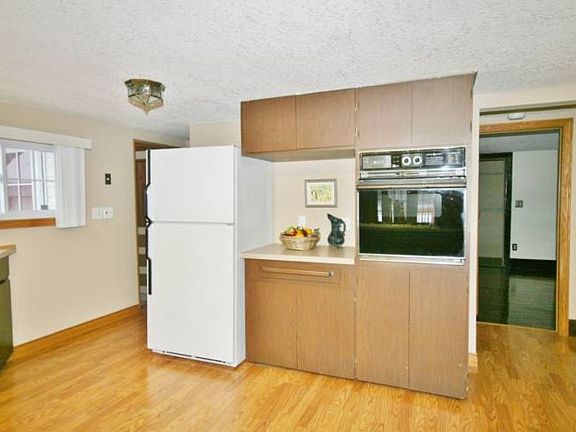 More storage is seen here with the full size refrigerator and wall oven.