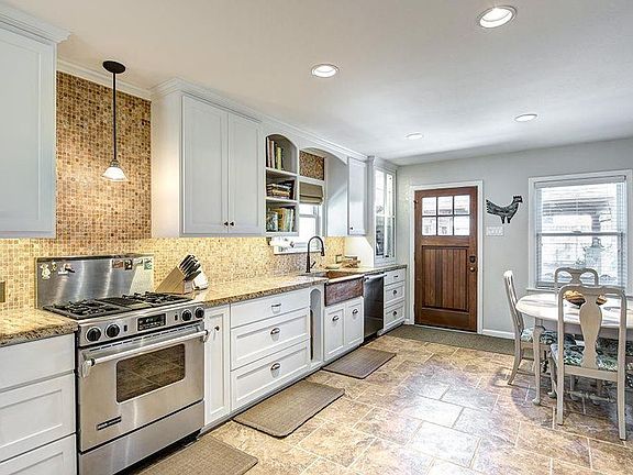 Great kitchen with custom cabinets and high-end appliances,