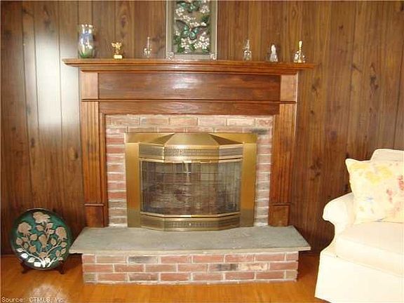 A gorgeous mantle and raised hearth make this gas fireplacestand out. Paneling can be easily painted with your favorite color to make this fireplace pop