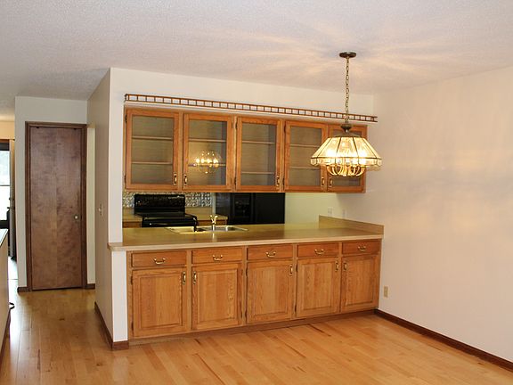 This buffet area separating the dining room and kitchen provides a nice division from the kitchen and adds great storage.