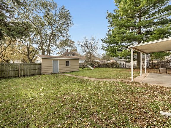 Attached garage PLUS detached garage -- perfect for multiple cars or hobbies!   Double-gated entranc