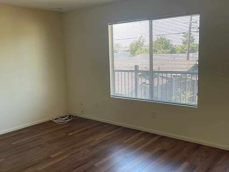 Bright, spacious living room with luxury vinyl plank flooring & cable hookups.