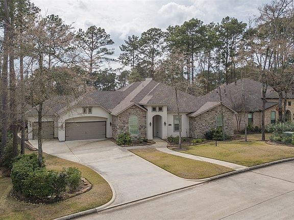 This beautiful home is located in one of Bentwater's newest section where the home sites were platted bigger/deeper/wider. Look at the wonderful full three car garage with the extra wide driveway.