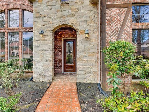 Beautiful brick and stone elevation with wood trim details.