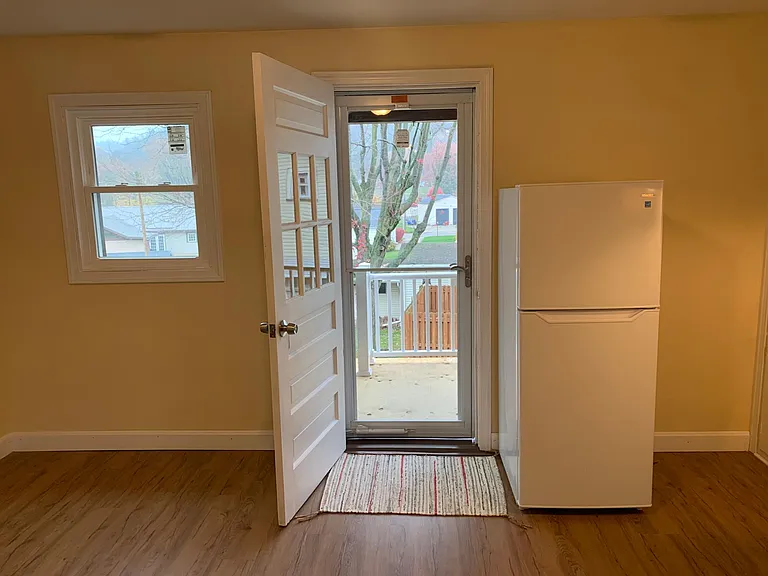 Door to back deck from kitchen area.