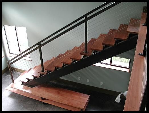 Stairs going up to loft and built in shelving