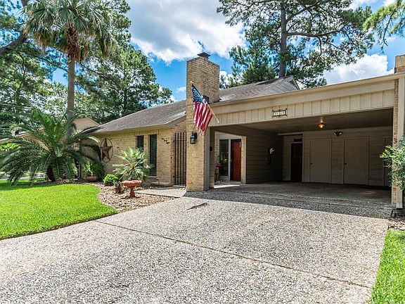 Large double drive way with storage closets in the carport.