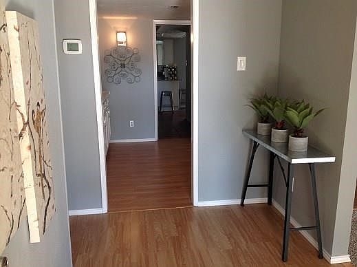 Welcome home to the fully remodeled and updated ranch style home! Laminate wood look floors greet you and lead down the hallway or into the dining room and bar area.