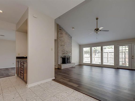 As you enter the home, you are greeted by a large living room with tons of natural light. The floors have been upgraded throughout the living room and bedrooms to high grade laminate wood.