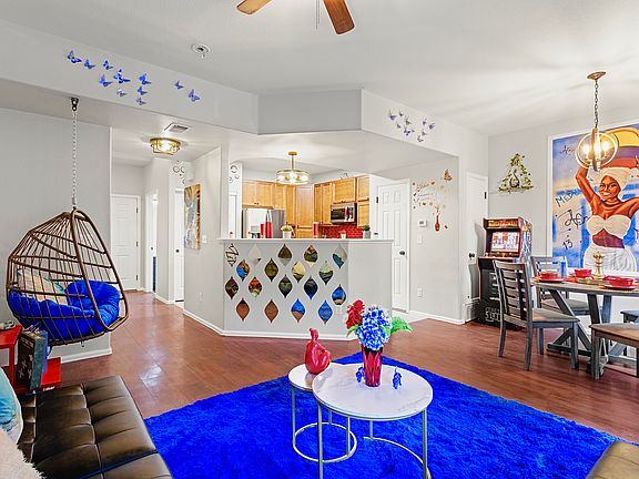 Spacious and open-concept living area with a cozy sitting nook and a fully equipped kitchen. Perfect for entertaining guests or enjoying a quiet night in.