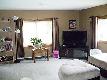 Large living room with two picture windows.
