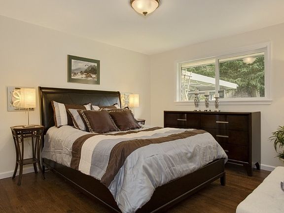 Master bedroom with view of backyard to look out onto. Great hardwood floors throughout