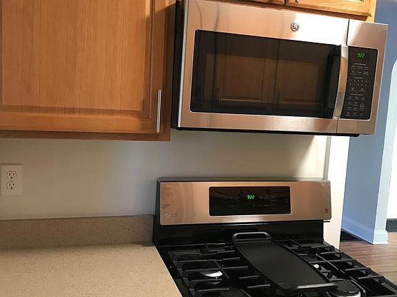 new microwave and 5 burner gas stove.