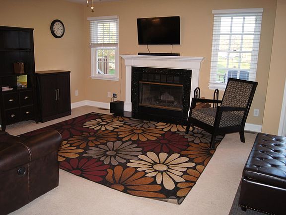 Living Room With Granite Fireplace