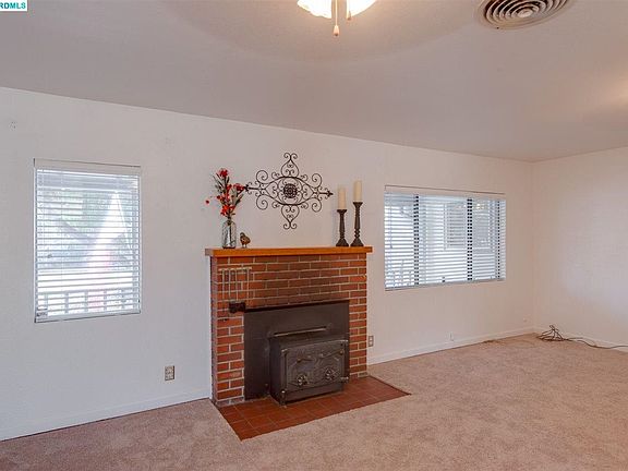 Great room features a built-in fireplace insert.