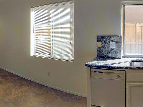 Granite counter tops, Onyx Sand matte porcelain floor. New Swiss Coffee color paint with satin sheen finish. New dishwasher, new gas range and ducted ventilation hood (June 2025).