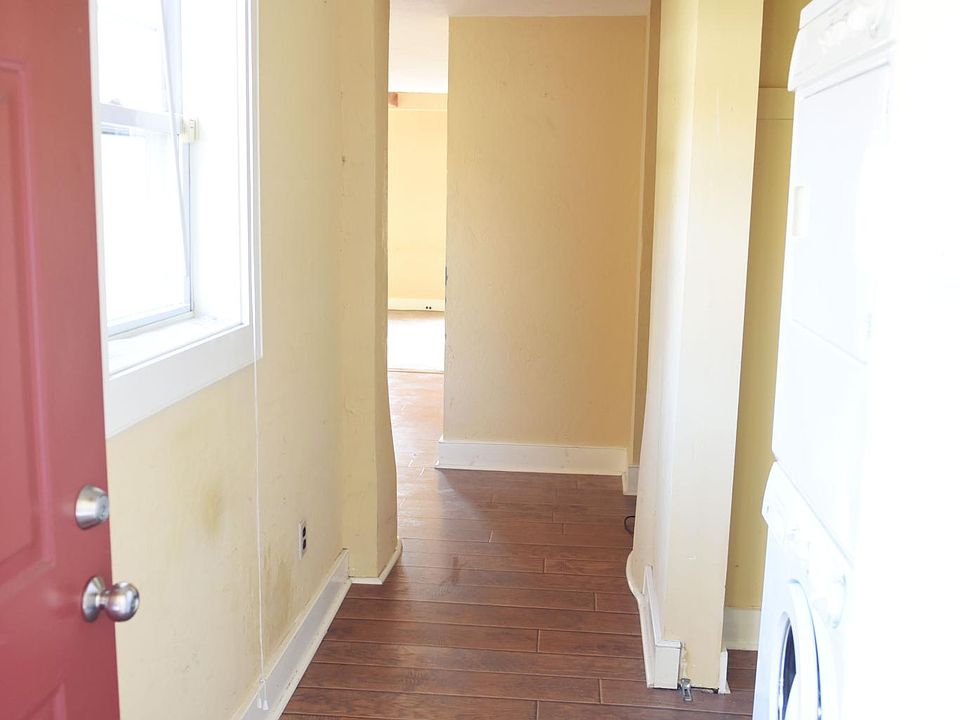 Entrance hall with full size washer and dryer in closet to the right