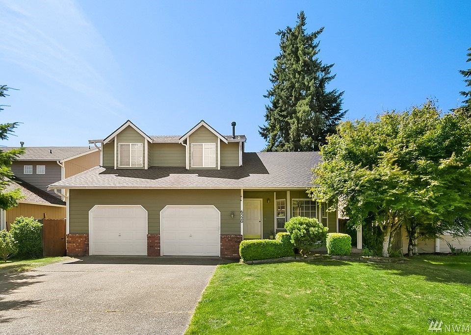 Two car garage and a beautiful front lawn!