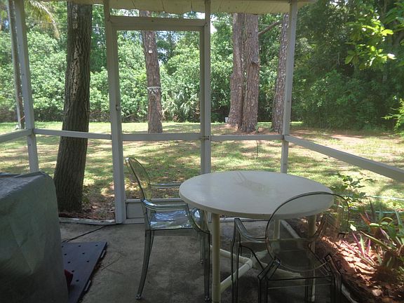 Pleasant, screened lanai and backyard.