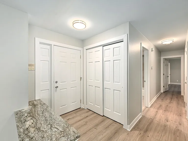 Entrance to Unit with Coat Closet