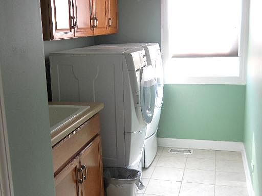 The first floor laundry/mudroom includes washer and dryer.